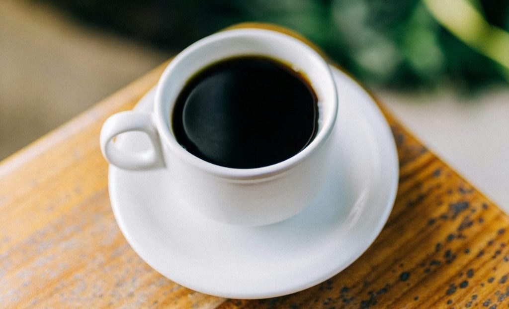 Coffee on a wooden table at a restaurant